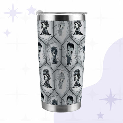 Creepy cute monster tumbler in black and white with chibi vampire, werewolf, mummy, and Frankenstein standing in a hexagon spiderweb pattern