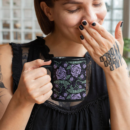 Tattooed woman laughing while holding anti-Trump dark floral gothic coffee mug