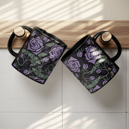 Two anti-Trump hidden message mugs with gothic rose botanical print hanging on kitchen cabinet edge