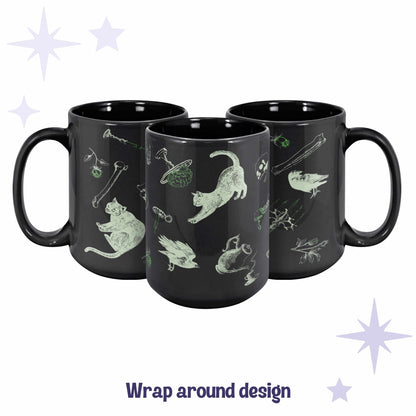 Three black ceramic mugs arranged to show the full wrap around acid green zombie icons pattern