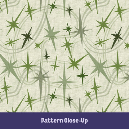 Close-up of the olive and sage green atomic starburst pattern on a warm cream background showing freehand-illustrated starbursts in multiple sizes with sweeping orbit curve details