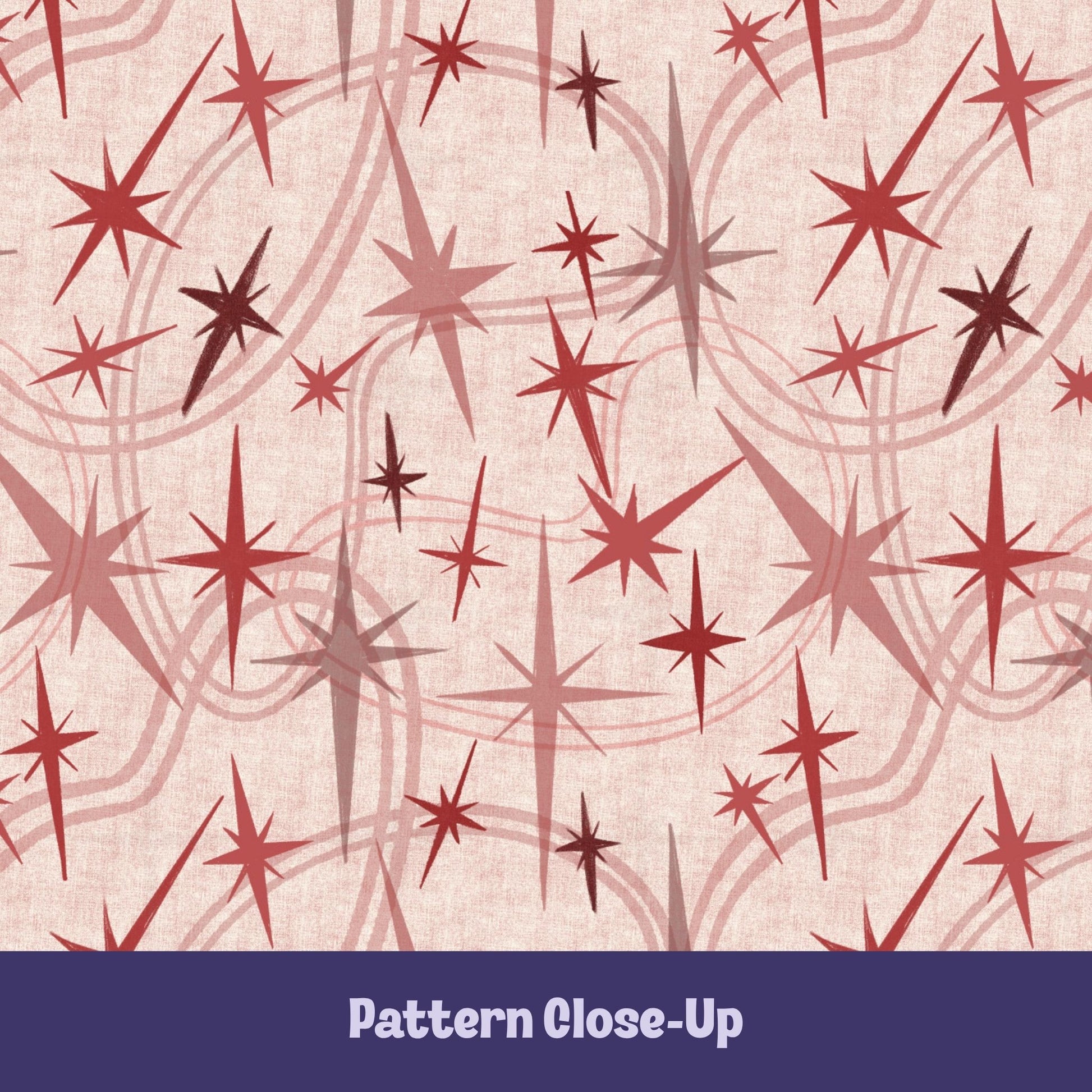Close-up of the dusty rose and crimson atomic starburst pattern on a blush background, showing freehand-illustrated starburst motifs in varied sizes with concentric orbit curve details