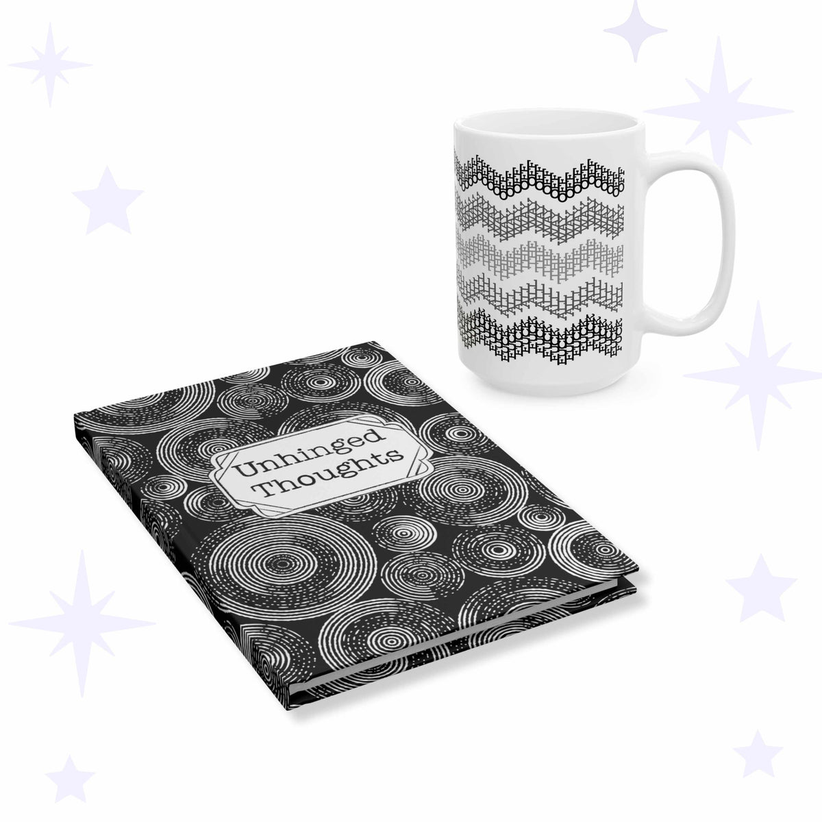 White ceramic mug with five gray chevron stripes beside a black hardcover journal covered in white concentric circles with an Unhinged Thoughts label plaque.