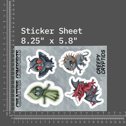 Cryptid sticker sheet shown beside inch and centimeter rulers measuring 8.25 by 5.8 inches