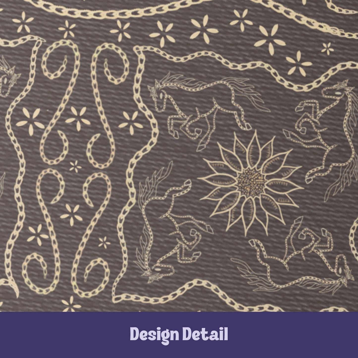 Close-up detail of vintage equestrian embroidered design showing galloping horses, sunburst medallion, and scrolling chain flourishes in cream on dark brown