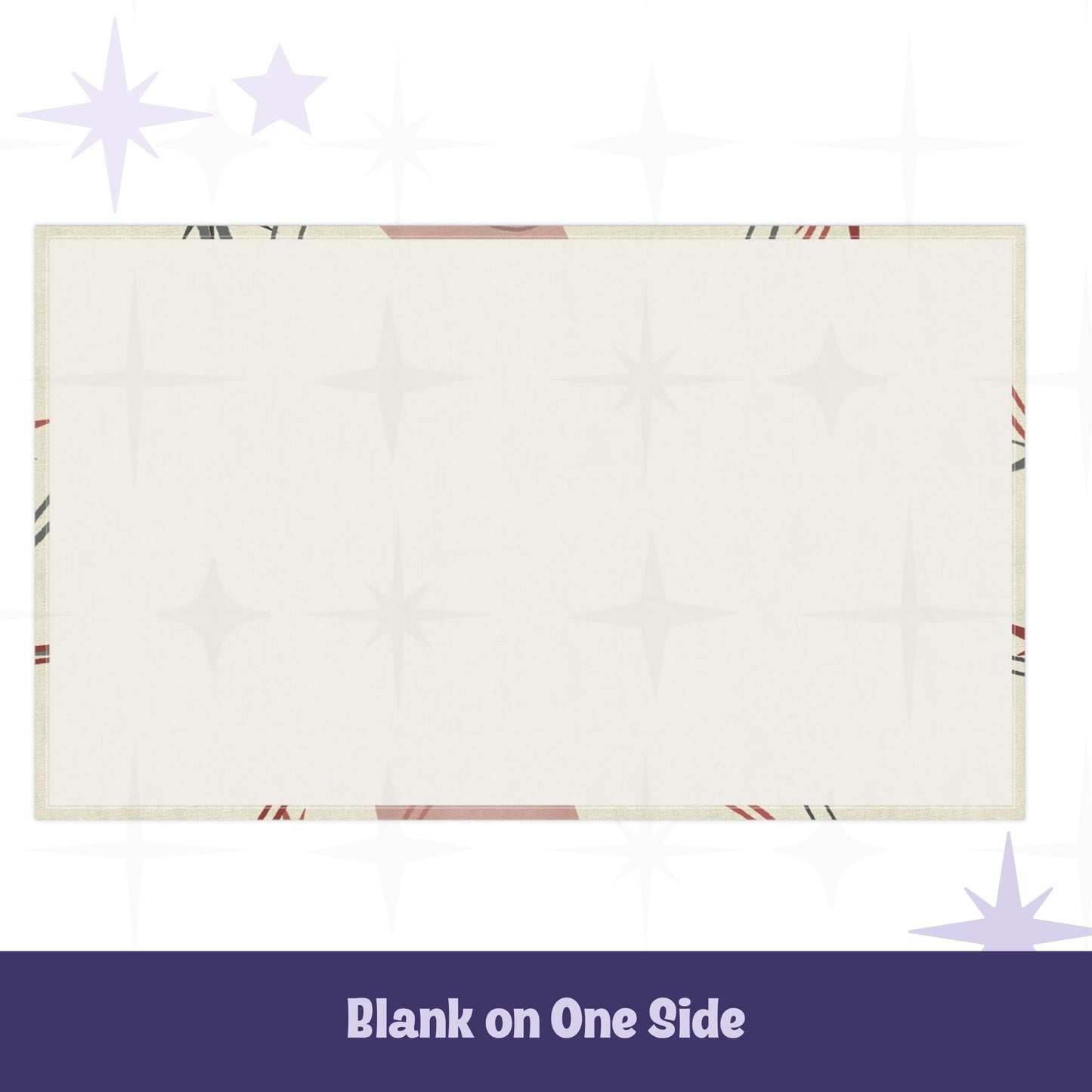 Reverse side of cotton twill tea towel showing blank cream fabric with hemmed edges and partial atomic starburst design visible at borders