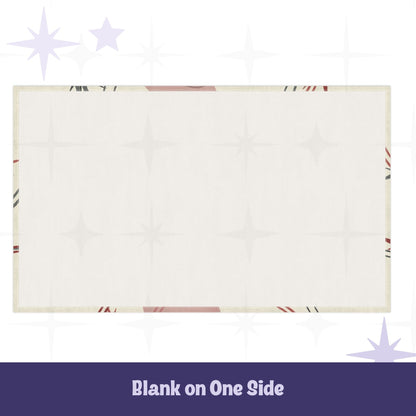 Reverse side of cotton twill tea towel showing blank cream fabric with hemmed edges and partial atomic starburst design visible at borders