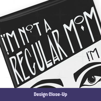 Close-up of top section of goth mom magnet showing Art Deco hand-lettered text I'm Not a Regular Mom on black with bold graphic eyebrow detail below