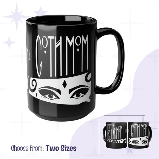 Glossy black goth mom coffee mug with Art Deco gothic hand lettering reading Goth Mom above illustrated dramatic eyes on white band, 15oz ceramic, two sizes shown