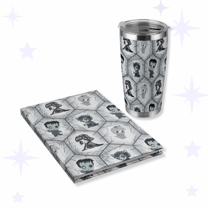 Grayscale stainless steel tumbler and matching hardcover journal printed with chibi vampire, werewolf, mummy, and Frankenstein's monster in a hexagon spiderweb lattice.