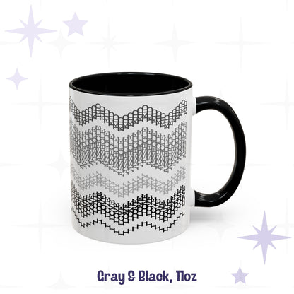 Front view of the Gray and Black 11oz hidden message mug with black handle and interior, showing the four-band chevron embroidery pattern, labeled 'Gray and Black, 11oz'