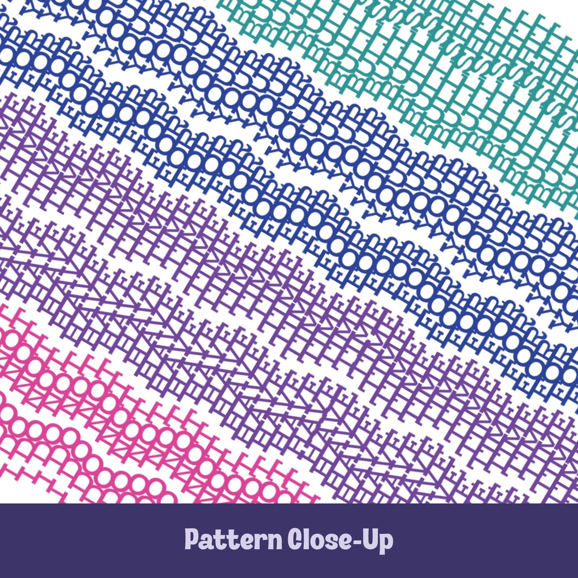 Close-up of colorful embroidery stitch pattern on hidden message mug showing chain stitch, eyelet, and chevron details in teal, blue, violet, and pink