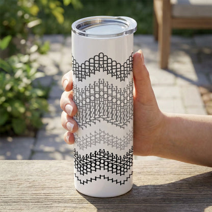 Gray Stripes I Love My Asshole Kid fair isle tumbler held outdoors on a patio — four tonal bands in black, charcoal, medium gray, and light gray on white stainless steel