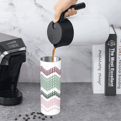 Coffee being poured into the Preppy Stripes I Love My Asshole Kid skinny tumbler on a kitchen counter — burgundy and green chevron hidden message pattern visible on white body