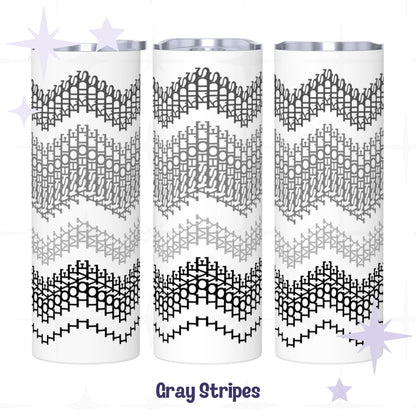 Three side-by-side views of the Gray Stripes colorway hidden message tumbler — graduating black, charcoal, gray, and light gray chevron embroidery stripe pattern on white stainless steel body