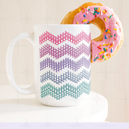 Bright stripes hidden profanity chevron mug in pink purple teal with a pink frosted donut balanced on the handle, retro styling