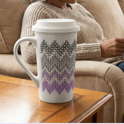 Purple ombre hidden profanity latte mug on side table next to person relaxing on couch, cozy home lifestyle setting