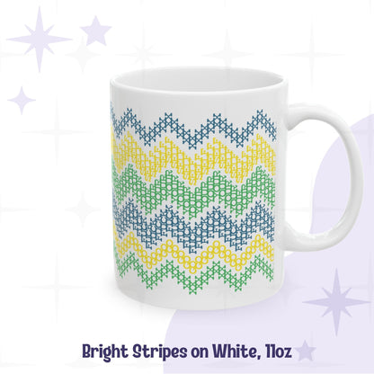 Hidden profanity mug 11oz all-white ceramic with bright stripe cross stitch pattern in teal yellow and green