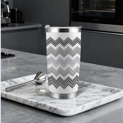 Gray stripe hidden profanity tumbler on marble tray in modern kitchen with cocktail bar spoon and stainless steel straw