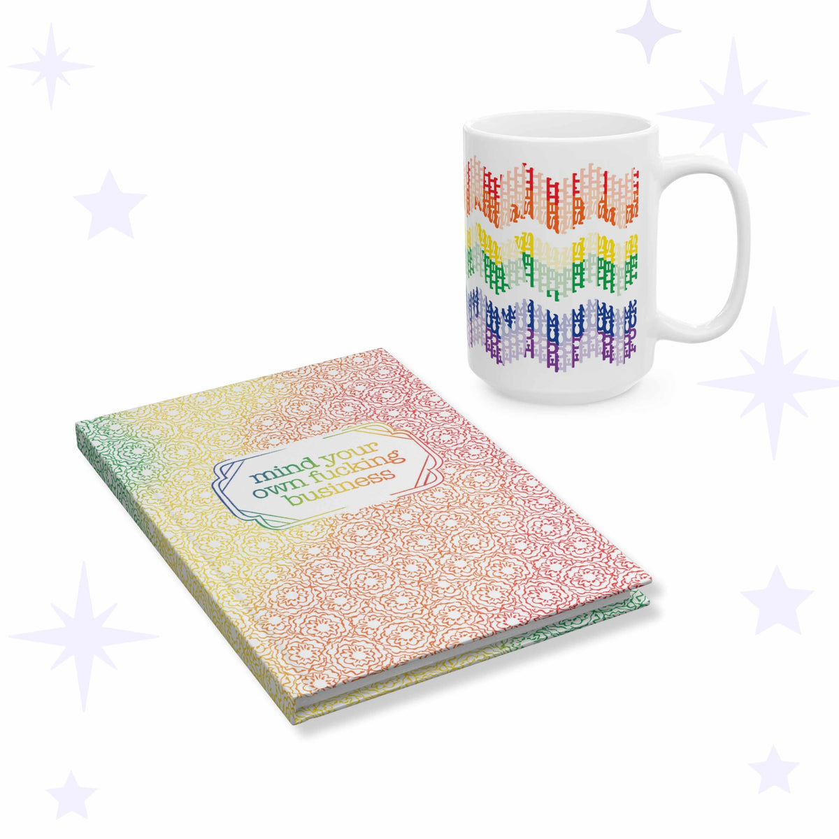 White ceramic mug with rainbow chevron typography beside a rainbow block print floral hardcover journal labeled mind your own fucking business.