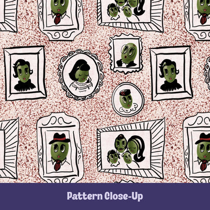 Close-up of retro olive portrait pattern on dusty rose tea towel showing hand-illustrated olive characters in ornate frames on terrazzo speckled background