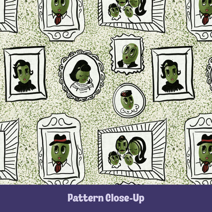 Close-up of retro olive portrait pattern on sage green tea towel showing hand-illustrated olive characters in ornate frames including cameo, fedora olive, family portrait, and bug-eyed olive on terrazzo speckled background