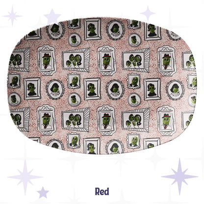 Retro olive portrait serving platter in red speckle colorway showing full allover mid-century gallery wall pattern of framed illustrated olive characters on warm blush crimson-speckle ground