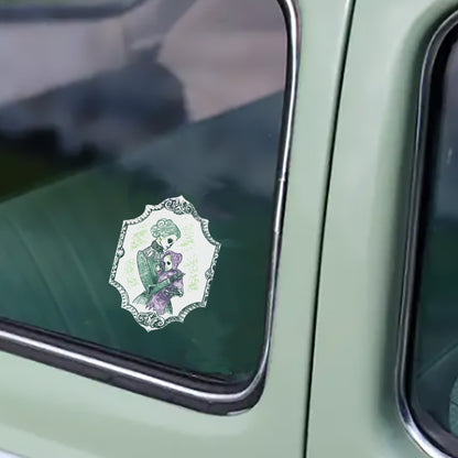 Skeleton mother and baby vinyl decal applied to the window of a sage green vintage truck