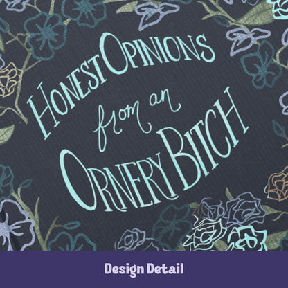 Close-up detail of hand-lettered text reading Honest Opinions from an Ornery Bitch in mint and seafoam typography on dark floral hardcover journal