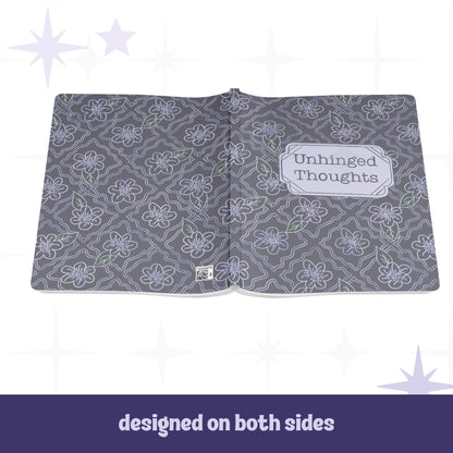 Unhinged Thoughts journal open flat showing full wrap design on front and back covers with dark floral botanical pattern