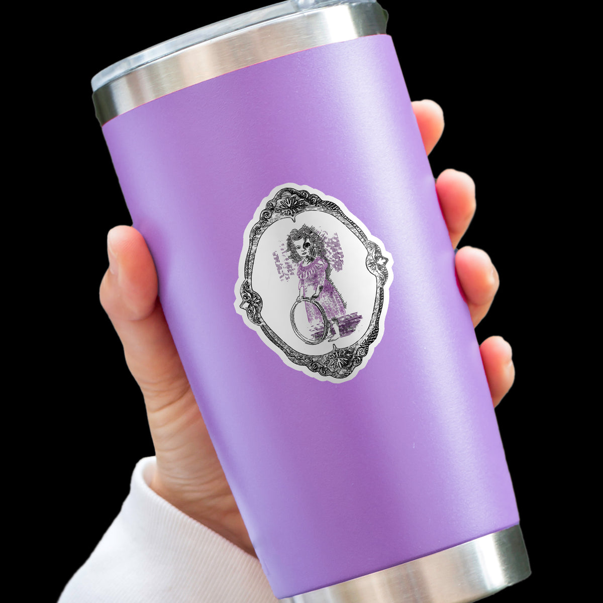 Gothic engraving style sticker on a lavender insulated tumbler held in one hand